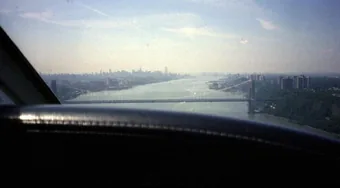 The George Washington Bridge spanning the
                        Hudson River, photographed from a light
                        aircraft heading south.